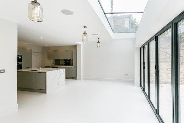 Dining space with light well looking back to kitchen