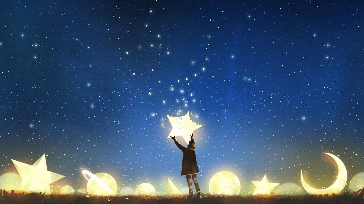 Person catching a falling star from the nigh sky