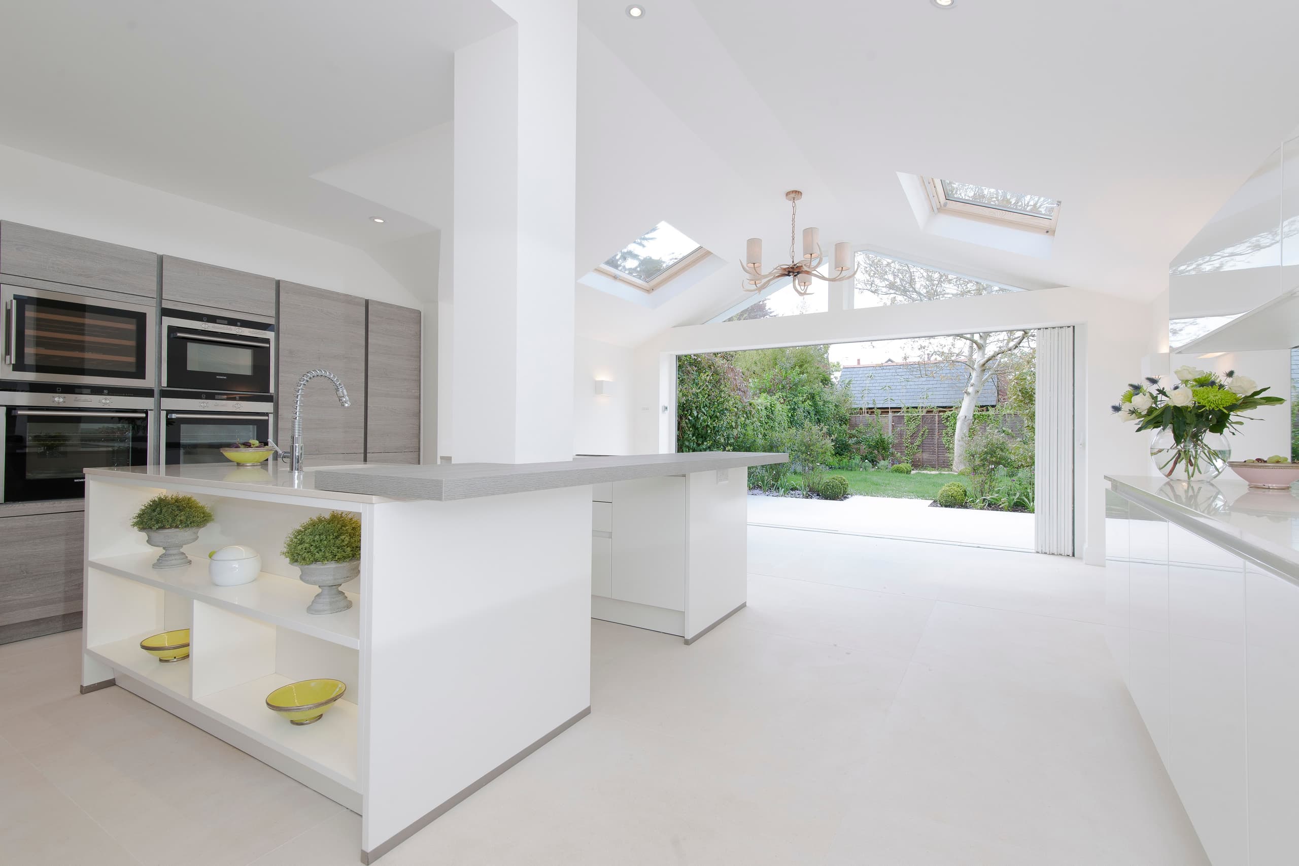 Open modern kitchen with open bi-fold doors