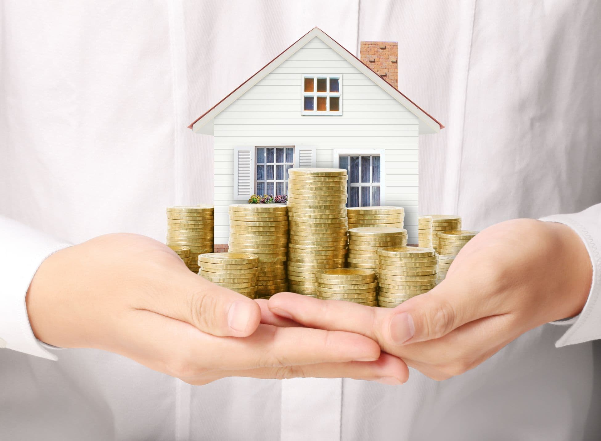 Hands holding a house and coins