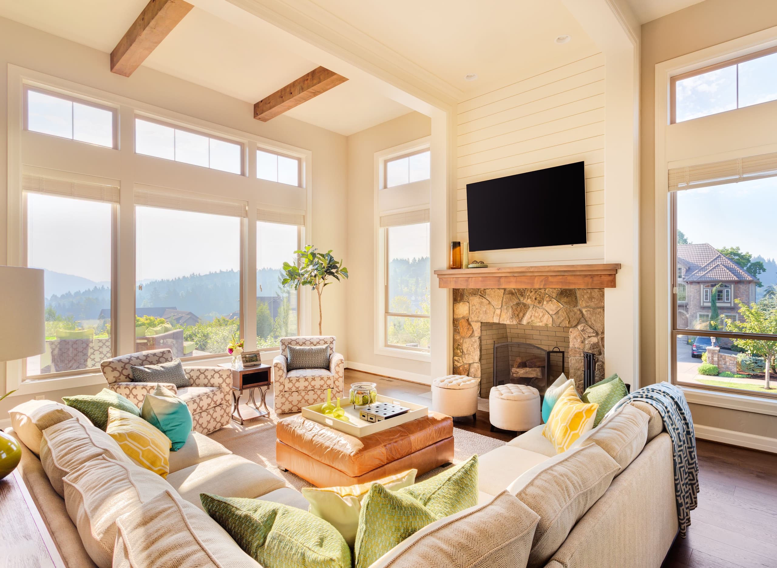 Modern living room with high ceiling and lots of natural light